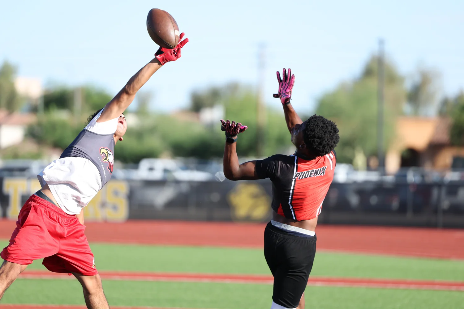 DB breaking up the pass in the endzone