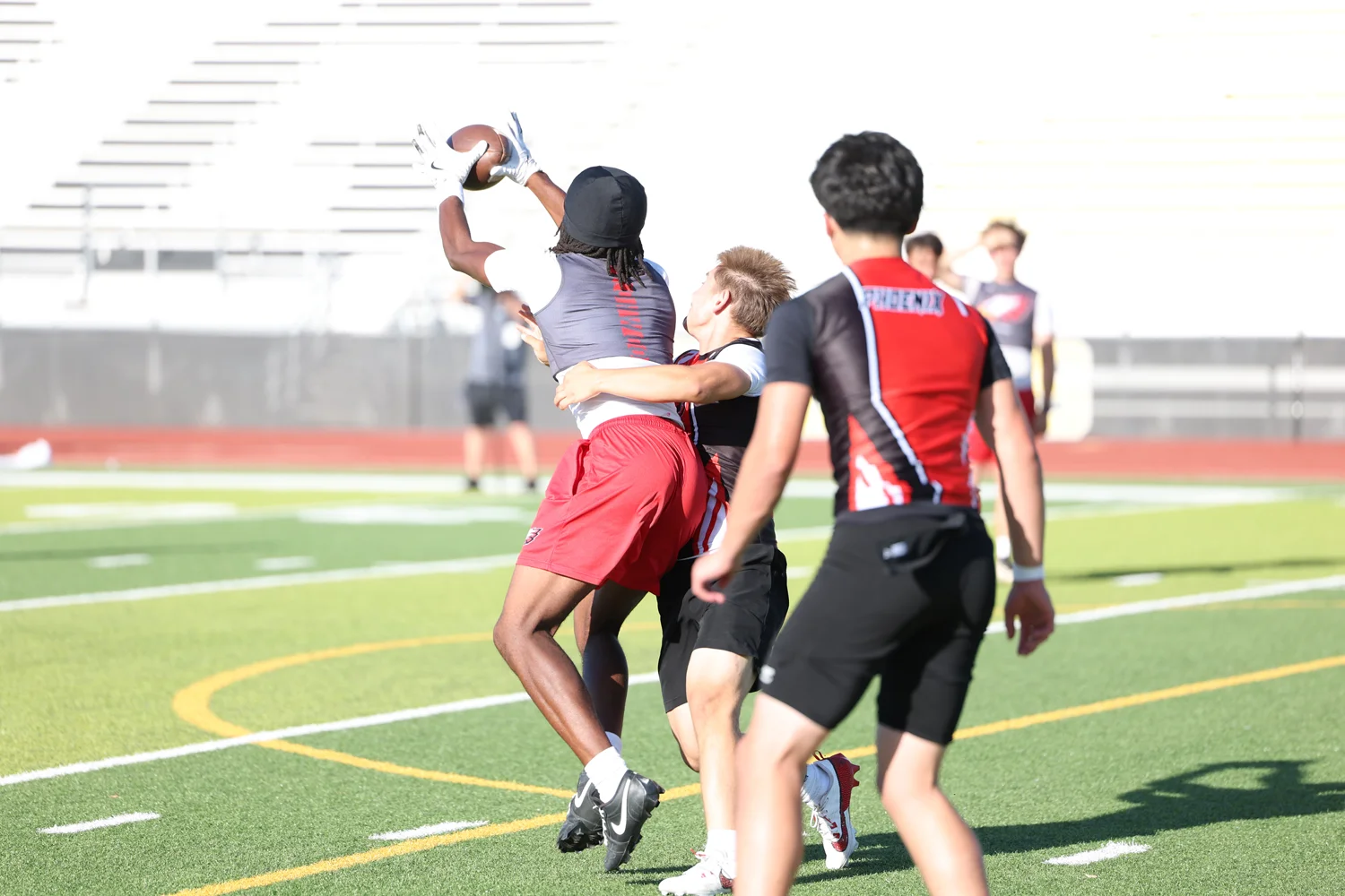 WR catching the ball with a defender on him
