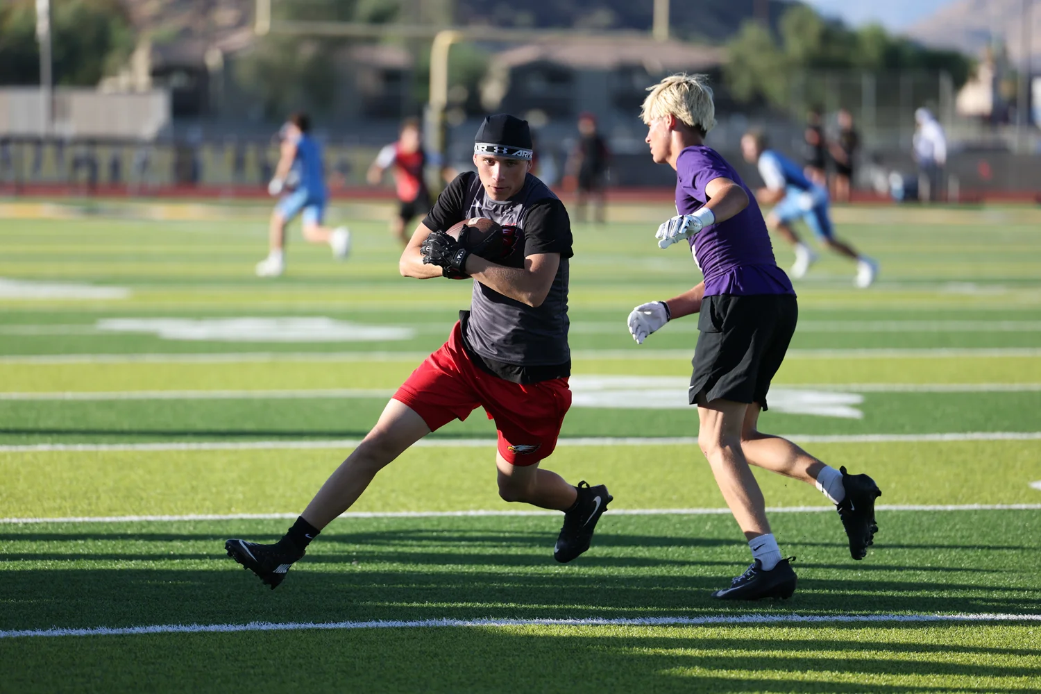 WR protecting the ball after the catch